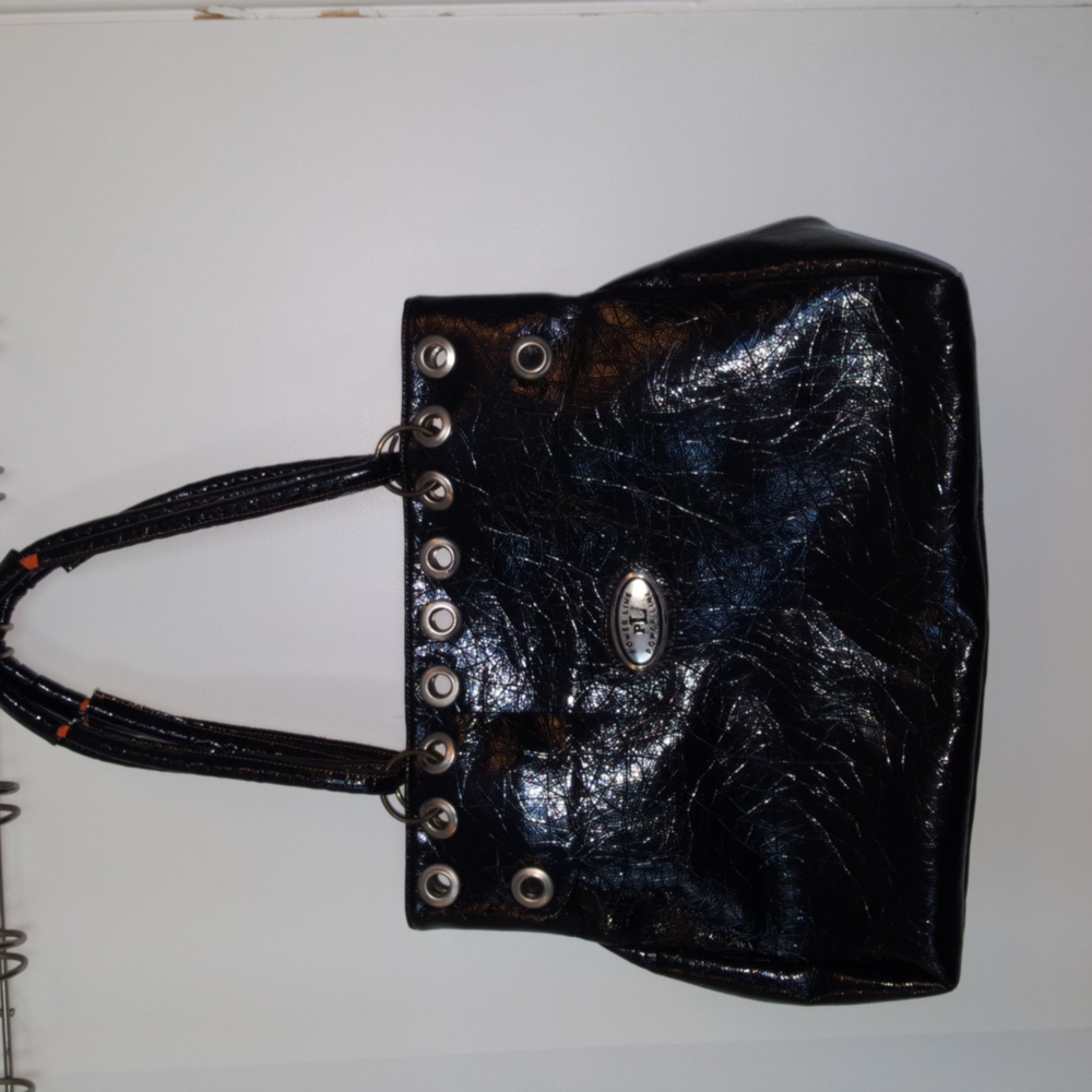 Black roomy zippered tote bag with small back pocket